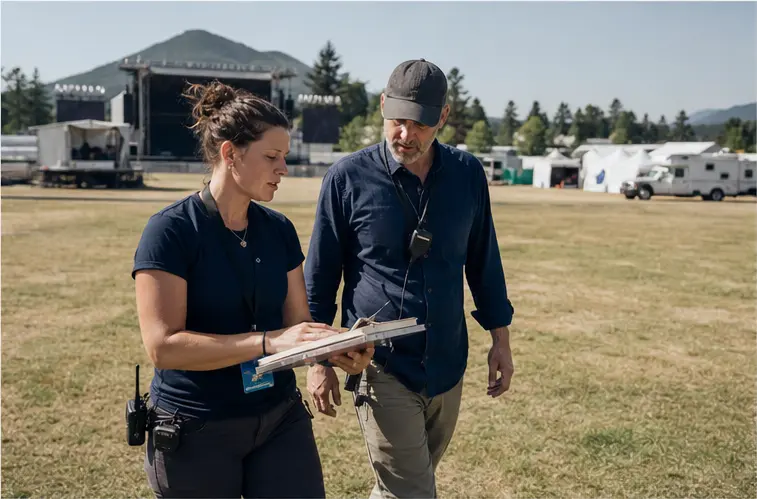 Concept visualization of event professionals reviewing an outdoor site